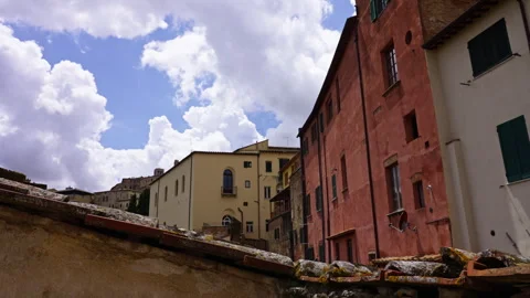 Colorful Tuscan Buildings under Dramatic Clouds Stock Footage 247277200