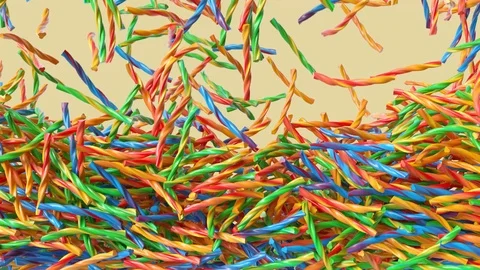 Colorful twisted candies sticks falling down from above and filling the screen. Vídeo Stock 123778253