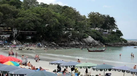 Colorful Umbrellas on the beach, People Swimming, Tanning, Playing, Water Stock Footage