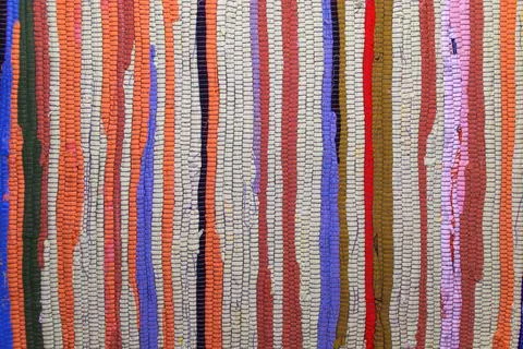 Colorful vertical mosaic pattern with vibrant stripes and textured surfaces Stock Photos