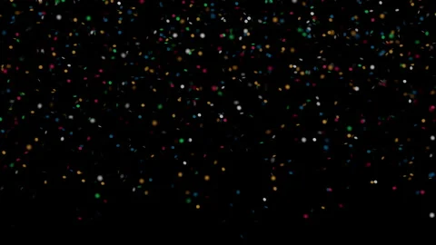 Colorful vibrant confetti falling slowly against dark black background 스톡 동영상 343556876