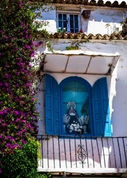 Colorful Virgin Mary on  restaurant balcony Marbella Spain Stock Photos