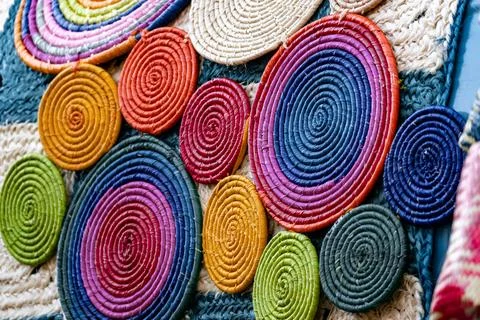 A colorful wall of circles made of different colored yarn Stock Photos