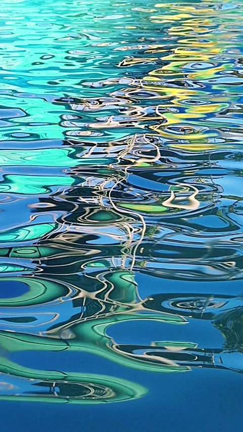 Colorful Waterslide Reflection on Swimming Pool Surface Видео 338401926