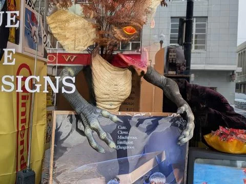 Colorful window display featuring a large 1980s Gremlins-style Stock Photos
