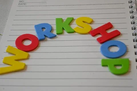 Colorful workshop lettering on a lined notebook Stock Photos