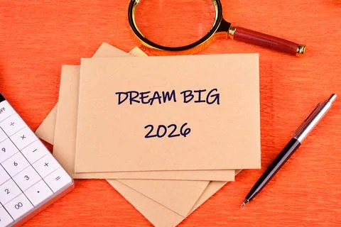 Colorful workspace features encouraging notes emphasizing the phrase Dream Big Stock Photos