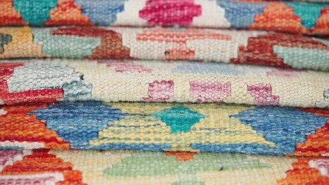 Colorful woven textiles displayed on a table Stock Footage 340245720