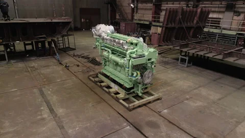 Colorful wrapped engine on floor and worker on repaired ship Vídeos de archivo 158943788