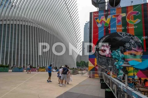 Colorful WTC mural street art and tourists next to Oculus building NYC ...