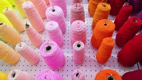 Colorful yarn wall in a creative tufting studio Stock Footage 342272395