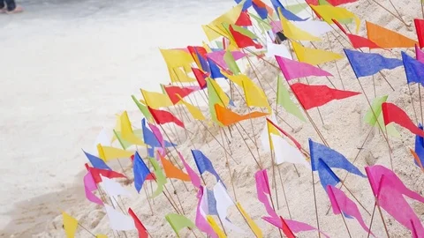 Colorfull flags in the templ with A pile of sand.. Stock Footage 72450131