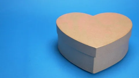Coloring box in the shape of a heart, pink spray paint. blue background Stock Footage 122345448