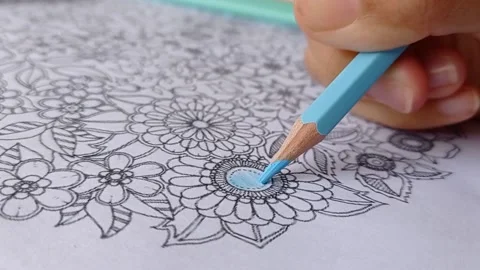 Coloring the drawing book with a blue Stock Footage 150523691