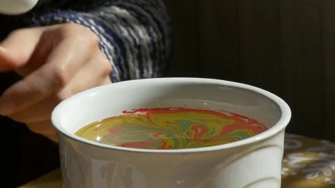 Coloring the Easter egg with marble Stock-Footage 73573213