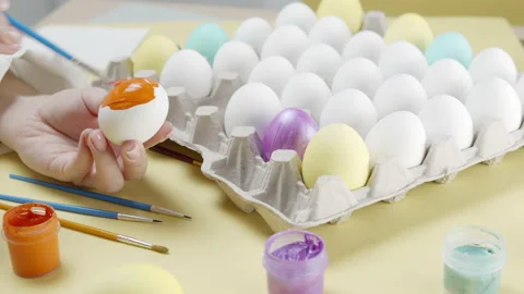 Coloring Easter eggs Stock Footage 147615397