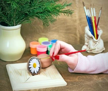 Coloring Easter eggs Stock Photos