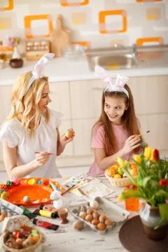 Coloring Easter eggs Stock Photos