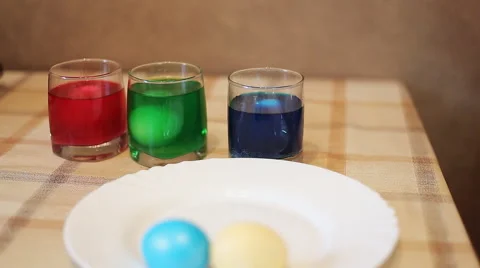Coloring eggs in bright colors Stock Footage 49078510