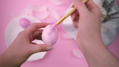 Coloring eggs for Easter. Pastel pink color. Stock Footage 122320821