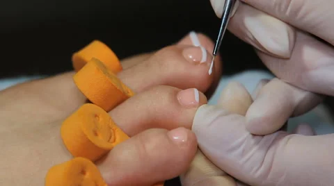 Coloring of nails on the right foot Stock Footage 64570150