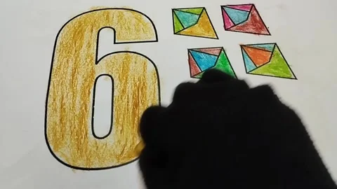 Coloring the number six with a light brown crayon color Stock Footage 224993589