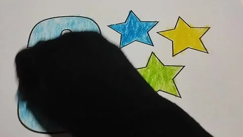 Coloring the number three with a light blue crayon Stock Footage 224979451