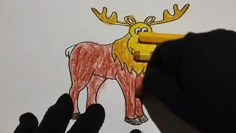 Coloring pictures of deer using brown, yellow and light brown crayons Stock Footage 224968159
