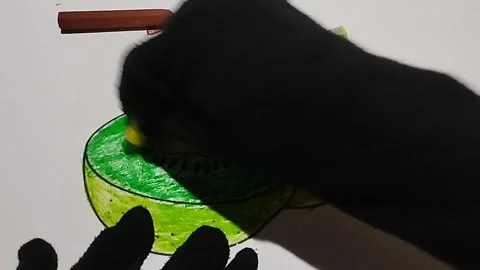 Coloring pictures of kiwi fruit using light green and dark green crayons Stock Footage 224968838