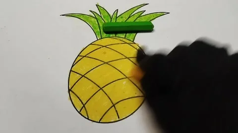 Coloring the shape of a pineapple using yellow crayons Stock Footage 224994388