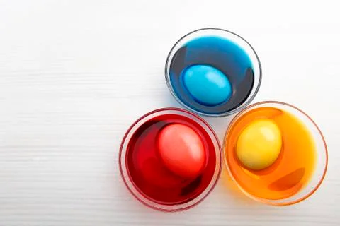 Coloring three easter eggs Stock Photos