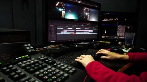 Colorist in a dark studio using modern color grading tools and equipment.Colour 스톡 동영상 181395298