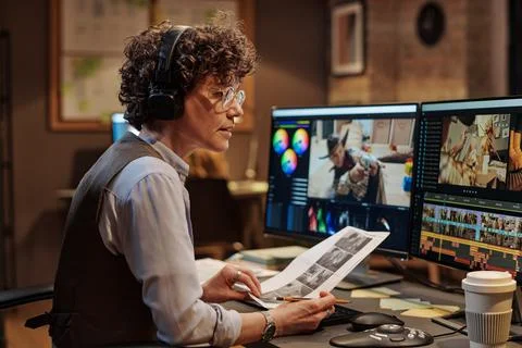 Colorist reading script before montage Stock Photos