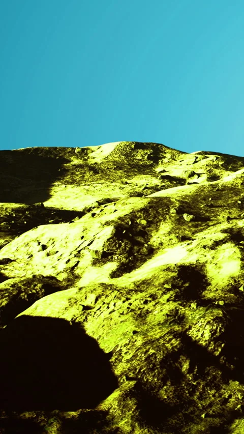 Colors and textures dance on the rugged mountain under a vivid sky Video stock 334050136