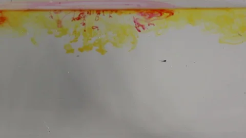 Colors in the water blend smoothly forming Stock Footage 127742731