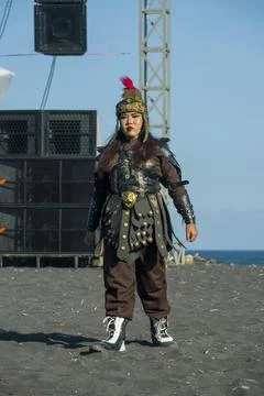 Colossal cultural performance featuring Javanese warrior on Watu Pecak Beach Stock Photos