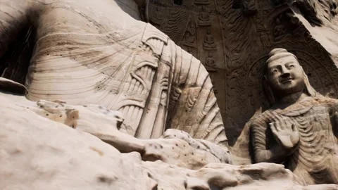 Colossal Stone Buddha Statues Carved into Cliff Face Vídeos de archivo 339079865