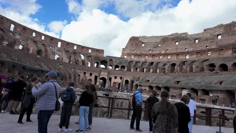 Colosseum Interior with Tourists Exploring the Ancient Ruins Stock Footage 281296035