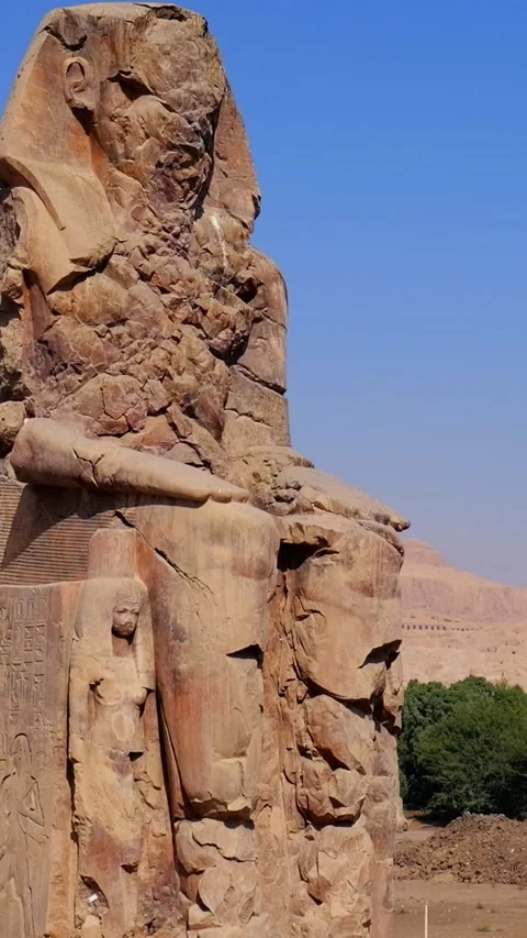 Colossi of Memnon massive stone statues of Pharaoh Amenhotep III in Luxor Egypt Stock Footage 337501164