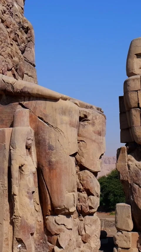 Colossi of Memnon massive stone statues of Pharaoh Amenhotep III in Luxor Egypt Stock Footage 337501229