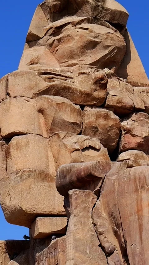 Colossi of Memnon massive stone statues of Pharaoh Amenhotep III in Luxor Egypt Stock Footage 337501367
