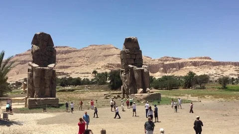 The Colossi of Memnon. Two massive stone statues of the Pharaoh Amenhotep III, Stock Footage 78191669