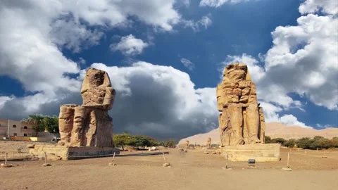 Colossi of Memnon, two massive stone statues representing the pharaoh, Luxor Stock Footage 253286576