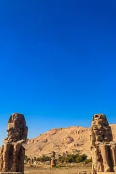 Colossi of Memnon, two massive stone statues of pharaoh Amenhotep III in Luxor Stock Photos