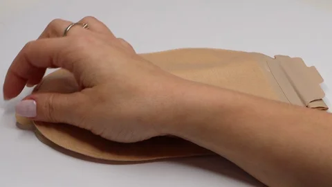 Colostomy bag, supply needed after colostomy surgery. Ostomy pouch. Stock Footage 122120174
