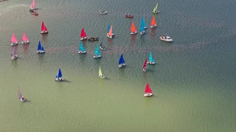 Colour-coordinated Firefly dinghies racing Wilson Trophy at West Kirby, Wirra Stock Footage 336481393