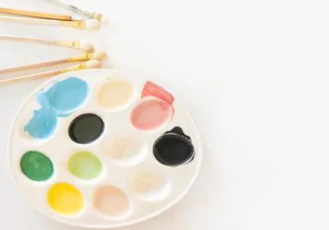 Colour Plate with Brushes Stock Photos