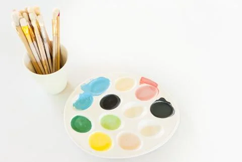 Colour Plate with Brushes Stock Photos