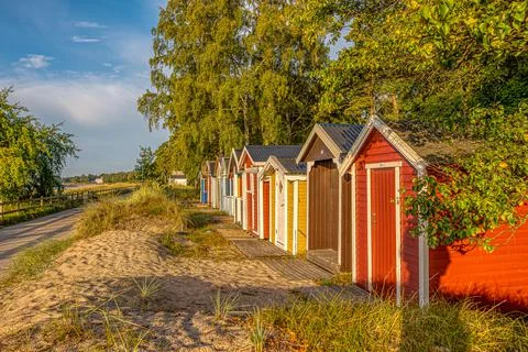 Coloured beach huts in a row Stock Photos