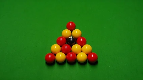 Coloured billiard balls after a break on a pool table, overhead shot Stock Footage 104688367